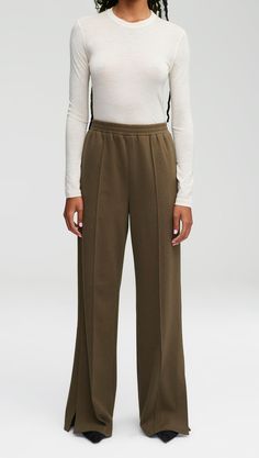 Add a sporty inspired piece to your fall/winter wardrobe with our functional Pull-On Pant. Made from our soft-to-the-touch Italian cozy jersey, this wide-leg style features a comfortable elasticated waist, side slits, and pintuck details for ultimate comfort. Fabric is resistant to wrinkles, it’s ideal for work, lounging, and travel. Olive Style, Slim Blouse, Lapel Coat, Christmas Clothes, Belted Blazer, Work Skirts, Fall Winter Wardrobe, Jersey Pants, Kick Flares