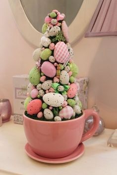 a pink cup filled with lots of candy