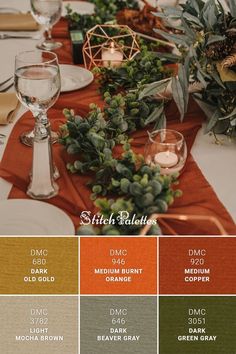 the table is set with orange, green and white place settings for an autumn wedding