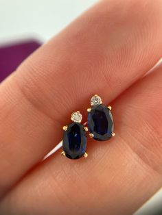 Welcome to Caviar and Cobwebs, thanks for stopping by ! Enjoy browsing.  Vintage 14k natural sapphire and diamond stud earrings. Stunning deep blue hue. The diamonds add a touch of glamour. Beautiful dainty earrings , the perfect addition to any collection. Great for someone with a September birthday. 1ct Sapphire total.  ** Measurements -  8mm x 4.3mm **  Gift wrapped and shipped safely from Canada.  Box in photos not included Blue Sapphire Studs, September Birthday, Sapphire Studs, Diamond Stud Earrings, Sapphire Earrings, Diamond Stud, Dainty Earrings, Jewelry Inspo, Natural Sapphire