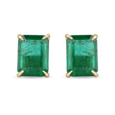 Featured here is a beautiful set of emerald cut, Zambian emerald studs in fine 18K yellow gold. Displayed are deep-green emeralds with very good transparency, accented by elegant claw prongs, allowing for the emerald to be shown in full view. The earth-mined, emeralds have a desirable lush green color with excellent qualities. These earrings are ideal for everyday use and are the perfect accessory for any outfit. Approx Total Carat Weight: 5.62cts Setting Style: Four Prong Setting Material: 18K Classic Emerald Cut Emerald Earrings, Emerald Statement Ring, Mens Emerald Rings, Emerald Studs, Emerald Earring, Earring Video, Colombian Emerald Ring, Emerald Green Earrings, Earrings Emerald