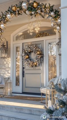 a christmas wreath on the front door of a house with lights and ornaments around it