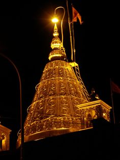 a very tall tower with a light on top