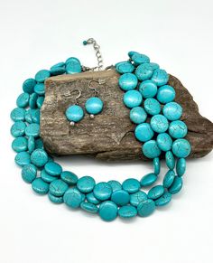 Triple Strand Turquoise Necklace With Matching Earrings  Turquoise is always trendy and will compliment all your cute dresses or jeans and T's. It's a gorgeous color and substantial necklace so has a bit of weight.  - Blue Turquoise magnesite round beads 16mm. (Size of a dime for reference) - Antique silver plated beads - Lobster clasp closure  - 3 inch extender chain  - 18 inch (which extends to 21 with extender) - Matching earrings, free Strung on strong professional beading wire, with wire gu Adjustable Turquoise Necklace, Turquoise Multi-strand Necklace For Gift, Turquoise Multi-strand Necklace For Party, Turquoise Multi-strand Beaded Necklace As Gift, Turquoise Multi-strand Necklaces For The Beach, Turquoise Multi-strand Necklace, Chunky Turquoise Necklace, Cowgirl Necklaces, Beach Wedding Jewelry