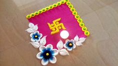 this is an image of a decorated cloth with flowers on it and the word om shanti written in gold