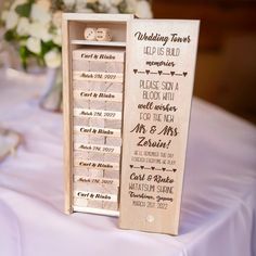 a wooden wedding game board on top of a table