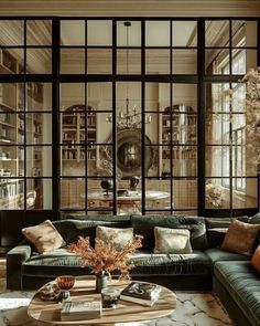 a living room filled with furniture and lots of windows