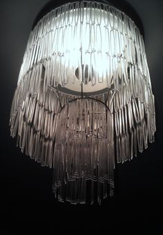 a chandelier hanging from the ceiling in a dark room