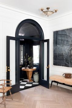 an entry way with black and white walls