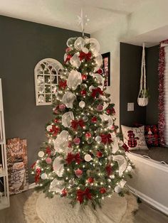 a christmas tree decorated with red and white ornaments