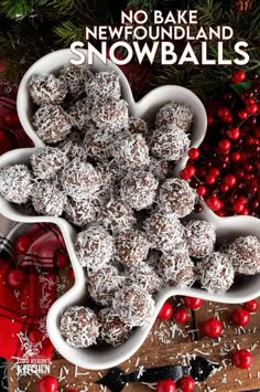 no bake snowballs in a heart shaped bowl on a table with christmas decorations