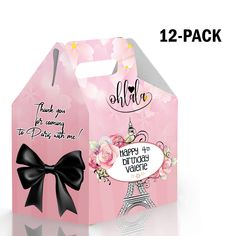 a pink gift bag with a black bow on it