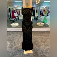 This Modern Stretch Jersey Fabric Gown Is Embellished With Geometric, Beadwork Design, Which Shows Of Sparkling Crystals, While Giving A Fitted Silhouette Look. Formal Black Gown With Rhinestones, Black Beaded Evening Dress For Gala, Elegant Beaded Black Evening Dress, Elegant Black Beaded Evening Dress, Royal Blue Velvet Dress, Geometric Beadwork, Velvet Evening Gown, Interview Dress, Johnathan Kayne