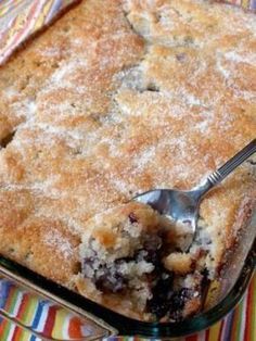 a close up of a pie in a pan with a spoon