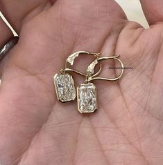 Bezel Setting 12x8 MM Radiant Cut Moissanite Earrings, Everyday Earrings, Radiant Cut Dangle, Bridal Earrings, 14K Gold Lever Back Earrings Detail about stones Moissanite & Simulated Stone: ----------------------------- ➠Stone Shape : Radiant ➠Stone Size : 12x8 MM ➠Weight: 12.12 TCW ➠Color: Colorless ➠Cut: Excellent ➠Clarity: VVS ✍This Listing's images are only for Imagin about this item. This is all our photography. If you place the order then the same item we can make it. ✍ This displayed all Gold Emerald Cut Diamond Earrings With Prong Setting, Gold Baguette Cut Earrings For Anniversary, Gold Emerald Cut Earrings For Anniversary, Radiant Cut Diamond, Diamond Dangle Earrings, Moissanite Earrings, Gold Engraving, Radiant Cut, Platinum Metal