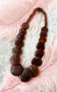 "♡ PLEASE ENLARGE PHOTOS FOR MORE DETAIL ♡ D E T A I L S * 1970s necklace * brown plastic/resin beads * threaded twist closure * label: none M E A S U R E M E N T S length: 22.5\" C O N D I T I O N Excellent vintage condition. No issues to note and ready to wear! ➳ Please read store policies prior to purchase. Thank you!! xoxo, Allyson ♥ Visit the shop! http://www.birthdaylifevintage.etsy.com ♥ Follow on Instagram! @birthdaylifevintage http://instagram.com/birthdaylifevintage" 70s Accessories Necklaces, Bohemian Round Brown Beads, Bohemian Brown Beaded Round Necklaces, Bohemian Brown Beaded Necklace, Handmade Retro Brown Necklaces, Retro Brown Handmade Necklaces, Retro Handmade Brown Necklaces, Brown Beaded Necklace With Large Round Beads, Brown Round Beaded Necklace With Large Beads