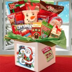 a christmas gift box filled with candy and snacks