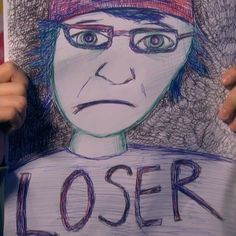 a drawing of a person holding up a sign with the words loser on it