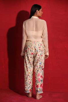 Beige pant set featuring hand embroidered floral jaal pattern with thread work. Paired with a full sleeve shirt and a halter neck blouse., Fit: Relaxed Blouse Halter Neck, Full Sleeves Blouse, Band Collar Blouse, Halter Neck Blouse, Band Collar Shirt, Floral Pant, Full Sleeve Shirt, Halter Neck Blouses, Button Pants