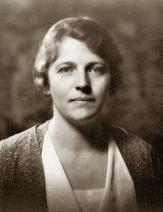 an old black and white photo of a woman