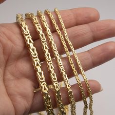 Square Byzantine Link Chain Bracelet 14K Yellow Gold All Sizes * Metal : Real 14K Gold (Properly Stamped, 14K) * Condition : Brand New * Finish : Polished * Average Weight :  8" - 2.0mm : 2.52 grams (0.31 g/in) 8" - 2.5mm : 3.58 grams (0.44 g/in) 8" - 3.0mm : 6.14 grams (0.76 g/in) 8" - 4.0mm : 8.73 grams (1.09 g/in) 8" - 5.0mm : 12.79 grams (1.59 g/in) * Length : Selectable * Width : Selectable * Clasp/Bail : Lobster Lock All of our items are brand new and are shipped with a gift box. Gold Byzantine Link Jewelry, Gold Byzantine Box Chain Jewelry, Gold Byzantine Jewelry With Box Chain, Gold Byzantine Chain Jewelry, Gold Byzantine Style Jewelry With Box Chain, Yellow Gold Byzantine Jewelry With Box Chain, Byzantine Yellow Gold Jewelry With Box Chain, Byzantine Style Box Chain Jewelry, Link Chain Bracelet