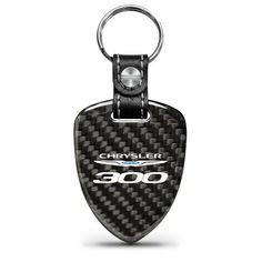 a black and white keychain with the word chrysler 300 on it's side