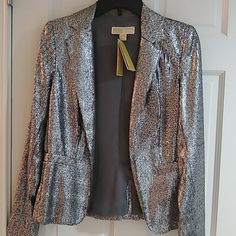 Gray Sequins Long Sleeve And 2 Front Pocket Designer Spring Blazer For Night Out, Designer Blazer For Night Out In Spring, Metallic Fitted Blazer For Fall, Metallic Fitted Blazer For Spring, Spring Metallic Fitted Blazer, Chic Fitted Metallic Blazer, Elegant Fitted Michael Kors Outerwear, Michael Kors Fitted Spring Outerwear, Fitted Silver Sequined Outerwear