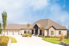 a large house that is in the middle of a driveway