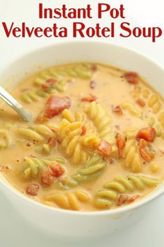 a white bowl filled with pasta and vegetables