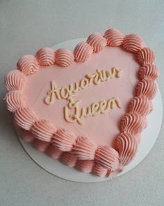 a heart shaped cake with frosting that says glorious queen