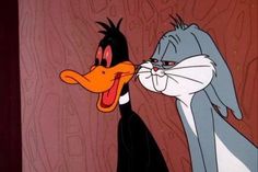 two cartoon characters one is kissing the other has an angry look on his face and nose