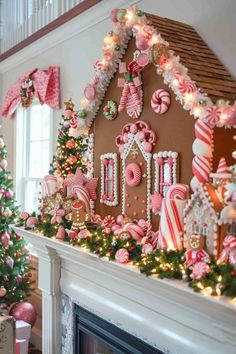 a decorated fireplace with gingerbread houses and candy canes