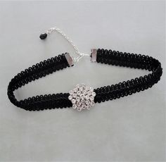 "Black braid choker necklace is accented by a focal circular silver rhinestone slider. The braid is fastened with silver crimp bars and there is a matching metal chain length with a black bead dangle for adjustable sizing from 13\" - 15\".  Width of the braid is 1/2\" and the diameter of the rhinestone focal is 1 \". There is a silver hook closure on the choker. All of my jewelry items come boxed, and ribbon tied and tagged for easy gifting." 1 Am, Black Braids, Head Pins, Ribbon Tie, Silver Rhinestone, Beaded Dangles, Black Glass, Black Beads, Metal Chain