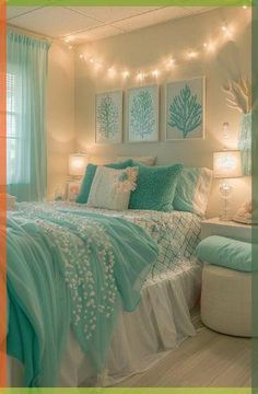 a bedroom decorated in aqua and white with string lights