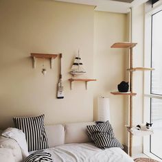 a living room filled with furniture next to a window