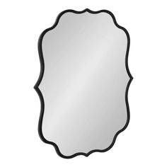 a black and white mirror with an ornate design on the bottom, against a white background