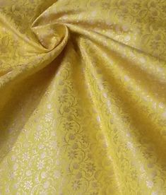 a close up shot of a yellow fabric