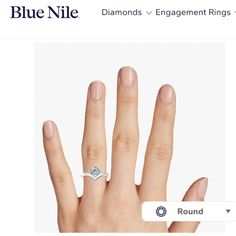 a person's hand with a diamond ring on top of their finger and the word, blue nile diamonds engagement rings