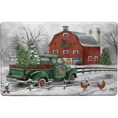 an old green truck parked in front of a red barn with christmas wreaths on it