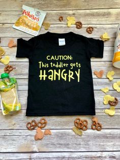 Excited to share the latest addition to my #etsy shop: Caution: This Toddler Gets Hangry Shirt Marine Mom Shirts, Funny Kids Shirts, Firefighter Shirts, Sports Mom Shirts, Hipster Babies, Funny Baby Clothes, Toddler Humor, Funny Shirts Women, Funny Shirts For Men