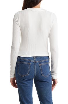 Refresh your essentials with this long-sleeve crop top cut from a stretchy ribbed knit. 18 1/2" length Crewneck Long sleeves 97% polyester, 3% spandex Machine wash, tumble dry Made in the USA Model stats: 5'10" height, 32" bust, 25" waist, 36" hip. Model is wearing size Small. Stretch Long Sleeve Cropped Sweater With Ribbed Neckline, Stretch Cropped Sweater With Ribbed Neckline And Long Sleeves, Stretch Ribbed Long Sleeve Cropped Sweater, White Cropped Crop Top For Fall, White Stretch Cropped Sweater, White Fitted Cropped Sweater, White Cropped Top With Ribbed Neckline, Ribbed Long Sleeve Stretch Crop Top, Trendy Cropped Sweater With Ribbed Neckline For Spring