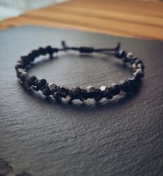 This unique and oryginal beaded macrame bracelet for Men is a perfect new piece or gift for a friend or loved one. The beads in these bracelets are strung on high quality black nylon cord. It is made of classy Black Lava, Agate  and two different hematite gemstones. It is comfortable to wear, great for casual days as well as dressed-up events. The bracelet is adjustable thanks to a macrame slide knot. It is about 18 cm when fully tightened and about 29 cm when expanded. If you need different size, feel free to ask Thank for visiting my shop! Please contact me if you have any questions!  ~~ Care instructions: To ensure that your piece of jewellery lasts a particularly long time, please avoid excessive contact with water, creams and perfumes and take it off overnight. Adjustable Hematite Beaded Bracelet With Gemstones, Adjustable Hematite Bracelets With Gemstone Beads, Adjustable Hematite Beaded Bracelets For Healing, Adjustable Hematite Gemstone Beads Bracelet, Handmade Hematite Crystal Bracelet Gift, Beaded Macrame Bracelet, Beaded Macrame, Black Macrame, Bracelet Bead