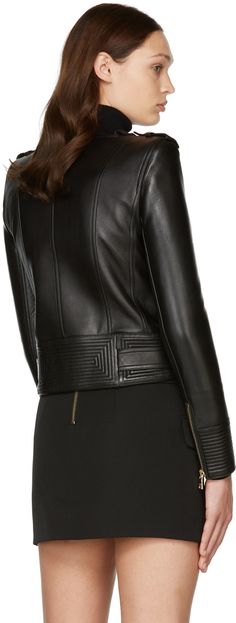 Long sleeve grained lambskin jacket in black. Notched lapel collar featuring press-stud fastening. Offset zip closure at front. Zippered pockets at waist. Buttoned epaulets. Padded shoulders. Zip closure at cuffs. Belt loops at hem. Adjustable belt with pin-buckle fastening at hem. Fully lined. Logo engraved gold-tone hardware. Supplier color: Black Luxury Leather Biker Jacket With Concealed Fastening, Luxury Black Leather Jacket With Concealed Fastening, Luxury Leather Jacket With Concealed Front Fastening, Luxury Biker Jacket With Concealed Fastening, Designer Leather Jacket With Concealed Fastening For Winter, Designer Winter Leather Jacket With Concealed Fastening, Chic Formal Leather Jacket With Zipper Closure, Chic Formal Leather Jacket With Zipper, Designer Formal Leather Jacket With Zipper