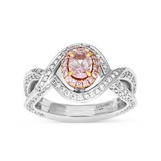 For the woman you adore, this sparkling diamond engagement ring proclaims her sophisticated style. Crafted in 99 platinum, this fashion-forward design showcases a shimmering oval cut fancy purplish-pink diamond wrapped in a rose gold pink diamond halo. The lovely diamond-lined twist shank lends a feminine appeal to the look. Set inside are beautifully equal cut pave diamonds for extra shine and dazzle. 
Available in all sizes, send us yours!
0.53 carat oval cut fancy purplish-pink diamond - Formal Pink Diamond Ring In Platinum, Luxury Pink Oval Diamond Ring, Elegant Pink Diamond Ring In Platinum, Oval Pink Platinum Jewelry, Elegant Pink Platinum Rings, Pink Oval Platinum Jewelry, Luxury Pink Diamond Ring With Halo Design, Exquisite Pink Diamond Ring With Accents, Luxury Pink Halo Diamond Ring