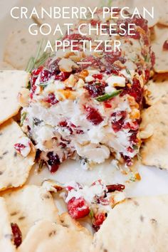 cranberry pecan goat cheese appetizer on a plate with crackers