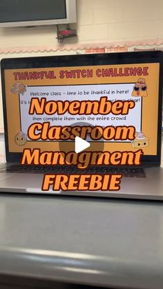 a laptop computer sitting on top of a desk with the words november classroom management freebie