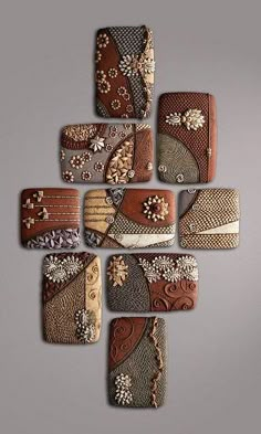 a group of different pieces of art made out of wood and metal with flowers on them