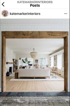 a living room filled with furniture next to a fire place under a wooden framed window