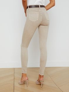 Our signature skinny jean with a longer, 30-inch inseam in an oatmeal beige. Tapered leg hugs from hip to ankle, while the contoured waistband defines and slims the natural waist. High-recovery fabric holds its shape, smoothing the silhouette without sacrificing comfort. | L'AGENCE Marguerite Skinny Jean In Biscuit High Rise Beige Pants For Everyday, Fitted Beige Tapered Leg Jeans, Everyday High Rise Beige Pants, Chic Fitted Cream Jeans, Fitted Cream Jeans, Beige High Rise Pants For Everyday, Fitted Beige Jeans With Tapered Leg, Chic Cream Fitted Jeans, Fitted Cream Jeans With Five Pockets