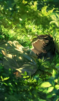 a person laying in the grass with their head on his chest and eyes closed,